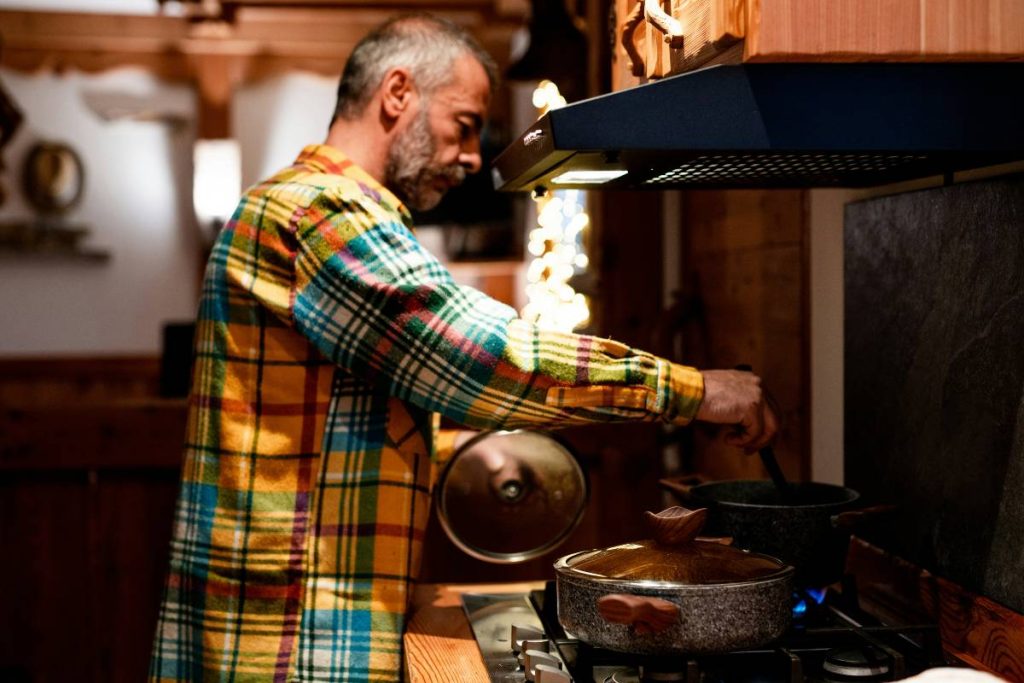 a man cook at home
